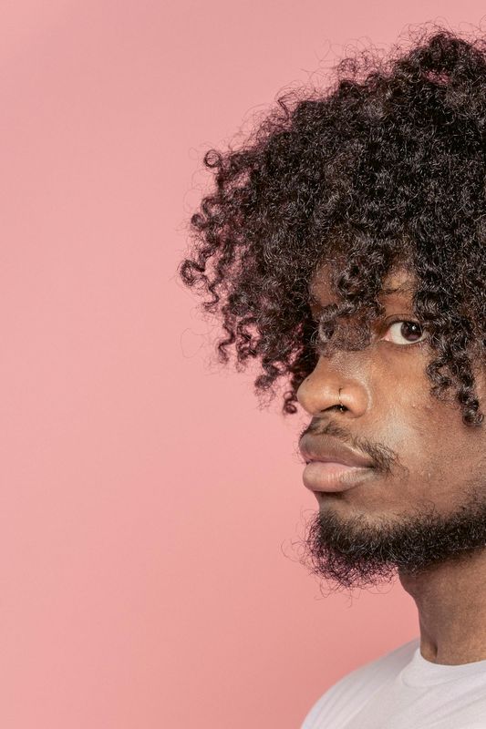 Person with a voluminous curly afro