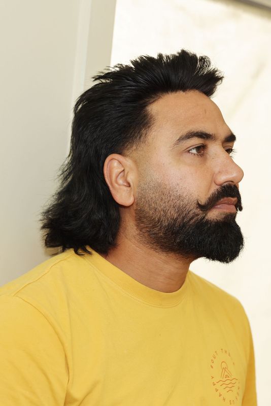 Man with a textured crop haircut and full beard